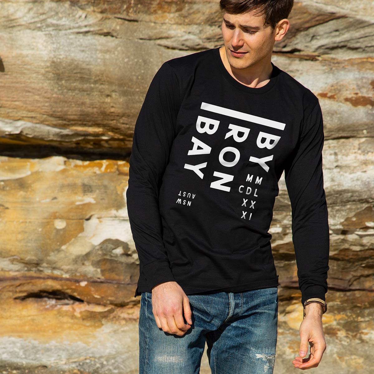 Byron Bay Unisex Long Sleeve Tee, Black, Front, worn by Joey