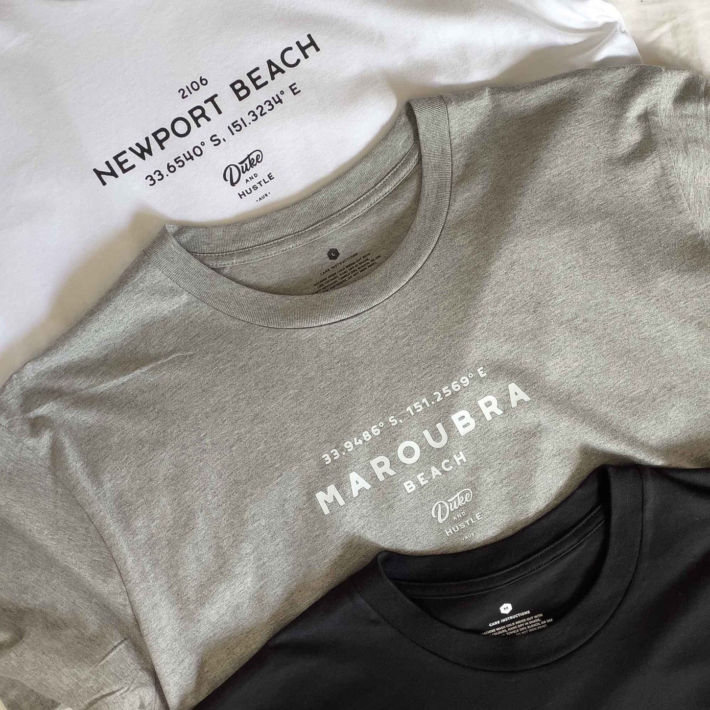 Selection of CoOrds Tees showing Maroubra Beach and Newport Beach