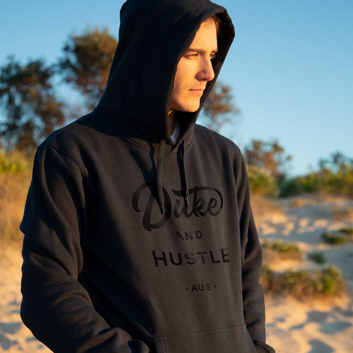 Joey in the Double Black Fleece Hoodie, watching the sunrise on a chilly August morning