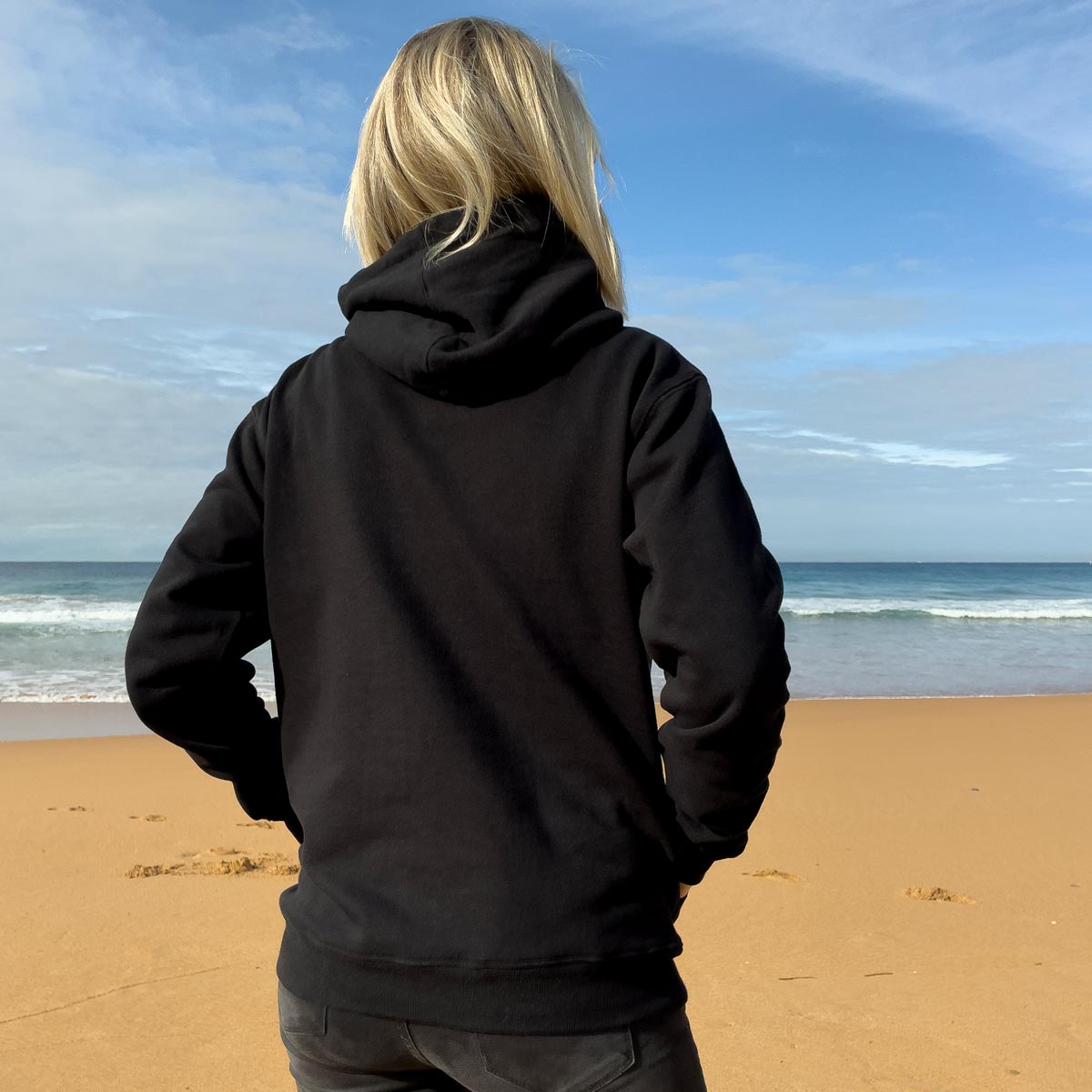 Our Fleece Hoodie, in Black, perfect for cool coastal days