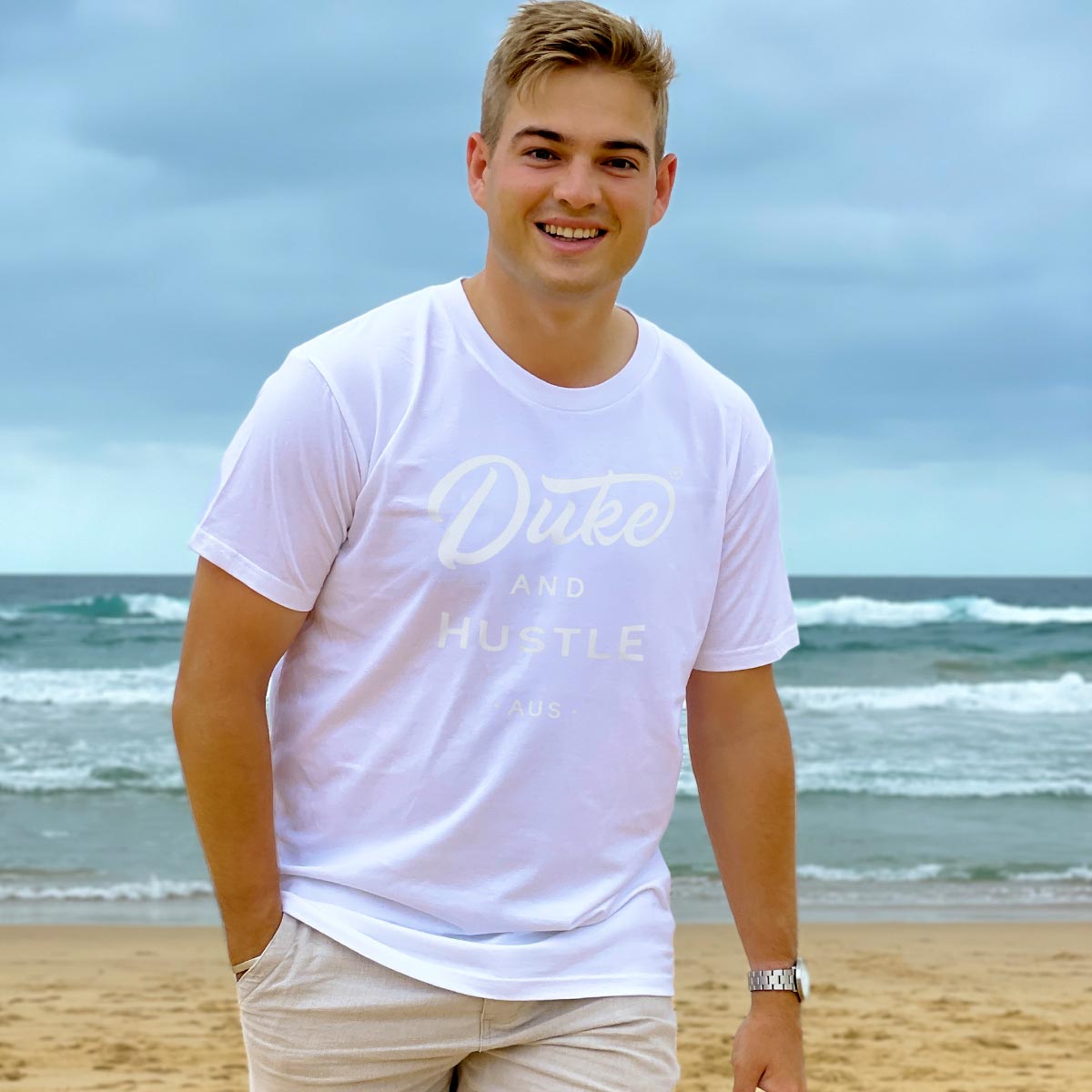 The Flat White on our Classic Fit Unisex Short Sleeve Tee, modelled by Tim