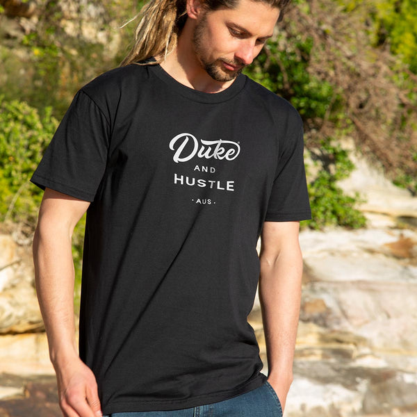Duke and Hustle Logo Unisex Classic Fit T Shirt on Australian Cotton, Black, Front, modelled