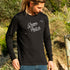 Ollie wearing the Green Patch Beach design on a black long sleeve cuffed tee