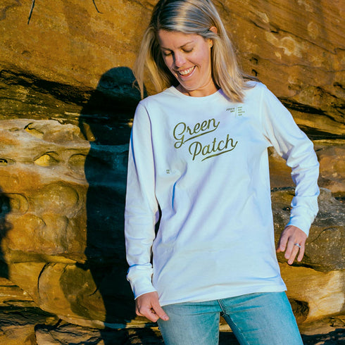 Ash wearing the Green Patch Beach design on a white long sleeve cuffed tee