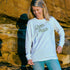 Ash wearing the Green Patch Beach design on a white long sleeve cuffed tee