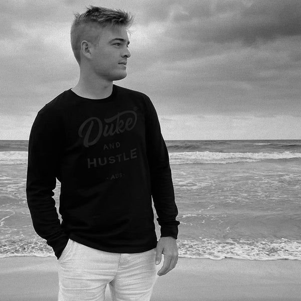 Unisex Long Sleeve Tee from the Double Black sereies, black vinyl logo on black cotton, worn by Tim