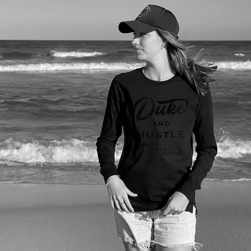 Unisex Long Sleeve Tee from the Double Black sereies, black vinyl logo on black cotton, worn by Em