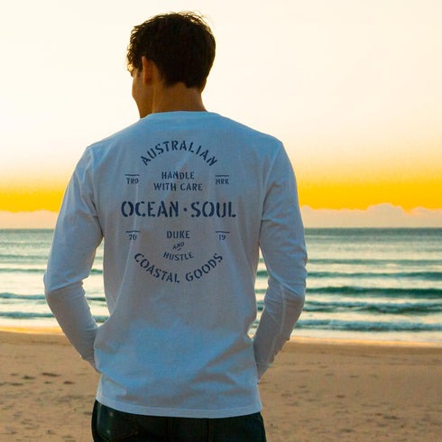 Joey wears The Precious Cargo graphic tee, on our 100% Cotton Long Sleeve Tee, white, graphic on the back